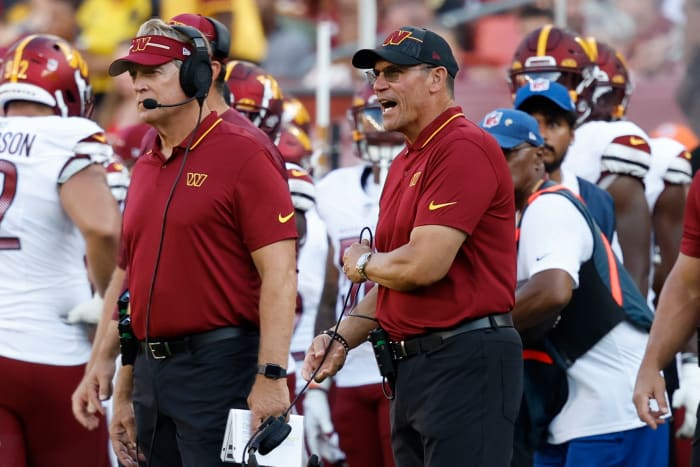 Washington Commanders defensive coordinator Jack Del Rio and Commanders head coach Ron Rivera stand on the sidelines against the Cincinnati Bengals during the second quarterat FedExField.